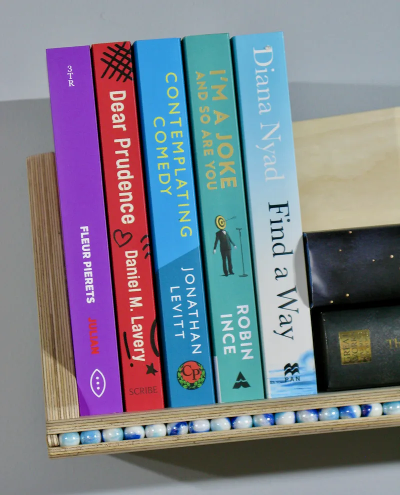 see-saw marble-run bookcase in birch ply